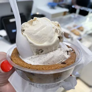 Cookie dough and drumstick in a chocolate chip cookie cup