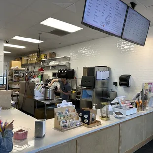 a woman working behind the counter