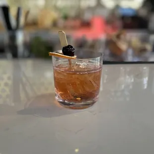 Mezcal old fashioned with all kinds of fancy stuff
