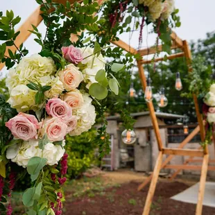 Sweet heart table back drop, Antique Edison lighting inside of an hexagon arbor