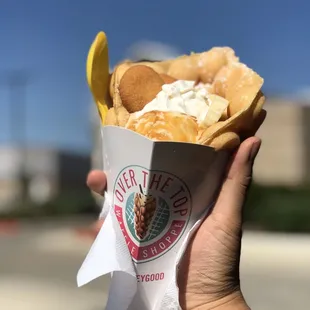 a hand holding a waffle shoppe