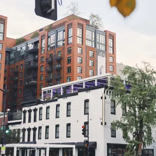 Come find us! Look for the gentlemen at the podium outside the white building.