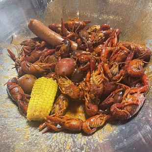 Crawfish, sausage, potatoes, and corn.