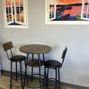 a table and chairs in a coffee shop