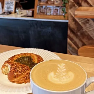 Spinach bun and orange vanilla cardamom latte