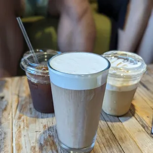 two cups of coffee on a wooden table