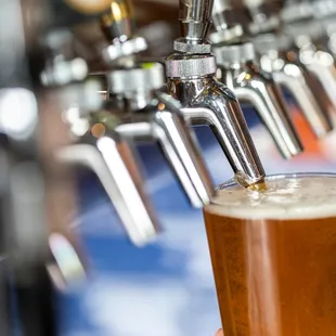 a pint of beer being poured