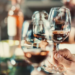 a person holding a glass of wine