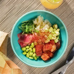 Big Eye Tuna Poke Bowl (wakame salad, sushi rice, avocado, edamame, pickled vegetables, chili threads)