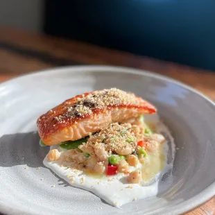 Seared Salmon with White Bean Mediterranean Salad, Black Olive Crumble, Whipped Feta, &amp; Lemon Vinaigrette