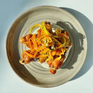 Confit Chicken Wings with Shaved Carrot &amp; Celery Salad, Hot Sauce Vinaigrette, Buttermilk Dressing, &amp; Bleu Cheese Crumbles
