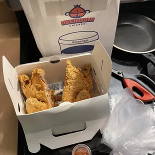 Here it is after I split it with the chili powder and gloves that they give you to eat it with.