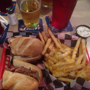 a tray of food including a sandwich and french fries