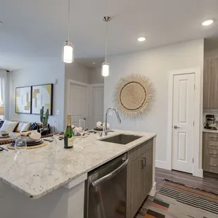 Marble countertops and stainless steel appliances.