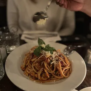 a plate of pasta with parmesan and parmesan