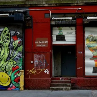 a red building with graffiti on it