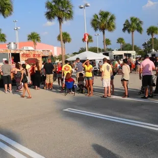 a crowd of people standing in line