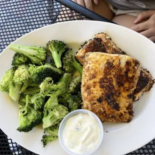 Grilled salmon and side of broccoli with slaw and two (only 2?) tots