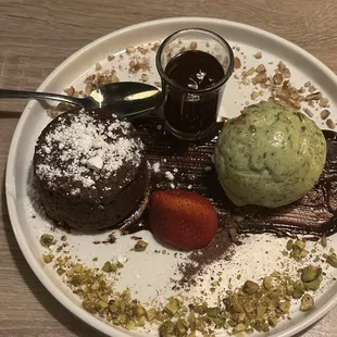 Chocolate soufflé.   Molten chocolate lava cake served with pistachio ice cream.