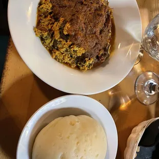 Egusi Soup with Goat and pounded yam - should have been chicken not goat
