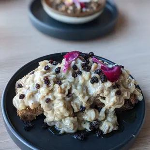 Sweet bread dessert in the foreground, custard in the background.