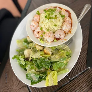 a plate of salad and shrimp