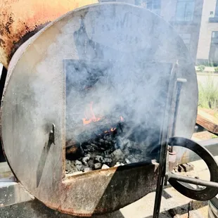 6/24 burning wood in the 500 gallon offset smoker