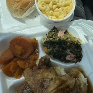 Delicious Smothered chicken, yams, greens, macaroni!