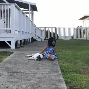 My daughter with a friendly local cat. This is in the center of Owens Retreat .