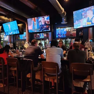 people sitting at the bar
