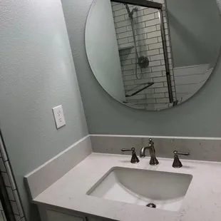 a bathroom sink and shower