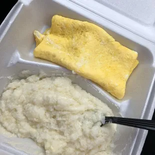 Three egg omelet and grits with cheese and butter