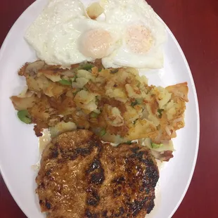 The most incredible pork chop and eggs. So tasty. If I could get this every morning I would.  Potato hash with peppers and onions. 5 Stars.