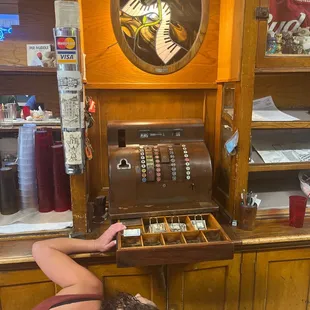 a man working on a cigar machine