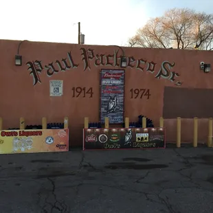 The side of Owl Liquors, with a tribute to Paul Pacheco Sr. Photo taken by my wife.