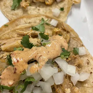 two tacos on a white plate