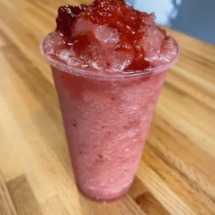 a close up of a strawberry and ice cream smoothie