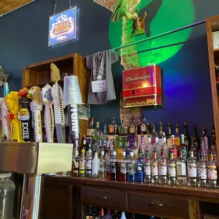 a bar filled with bottles of alcohol