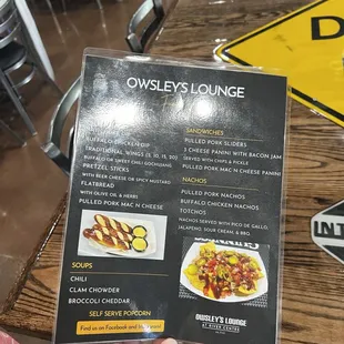 a person holding a menu