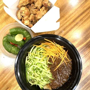 a bowl of noodles and a bowl of chicken