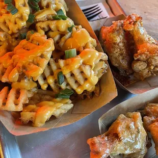 Wings with garlic Parmesan and waffle cheese fries.