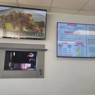They service the bar next door through this little window.