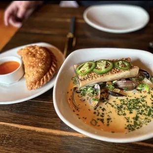 Beef empanadas and clam chowder with smoked bone marrow