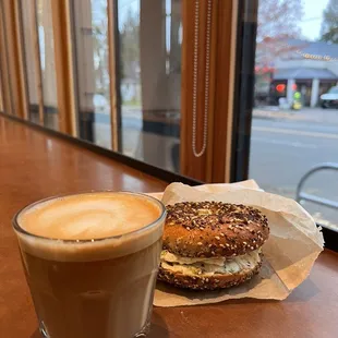 Oat milk cortado and an everything bagel with roasted jalapeño cream cheese