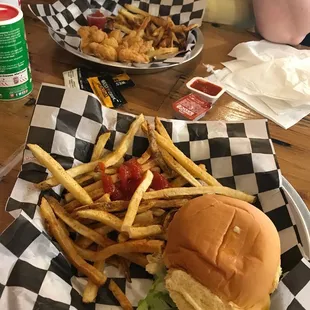 Cheese Burger an shrimp basket with fries .