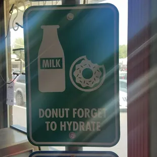 a donut and milk sign