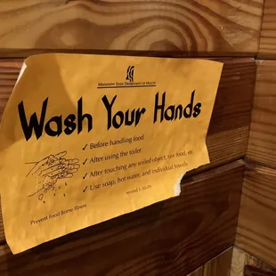 sensible sign posted in men's restroom