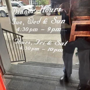 hours of operation post on rear entrance of restaurant (bar entrance)
