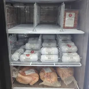 a refrigerator full of meat and eggs