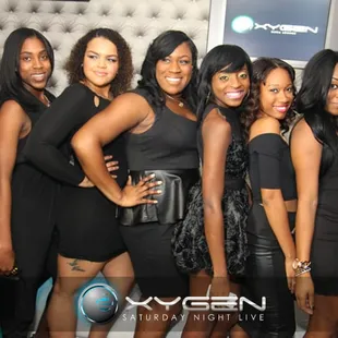 a group of women posing for a picture